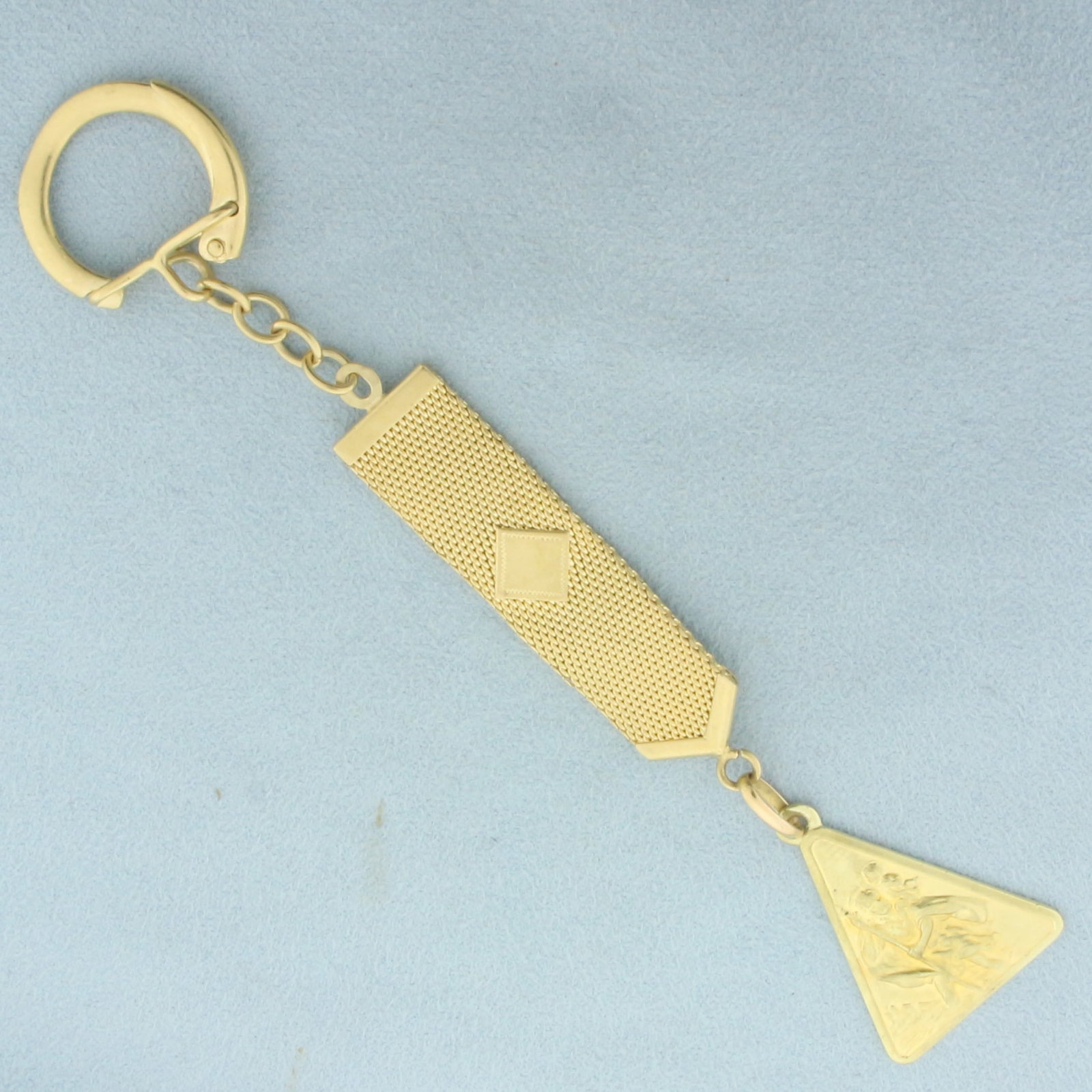 Italian Saint Christopher Key Chain in 18k Yellow Gold: In 18k yellow gold. Italian made. Engravable on reverse side. 5 inches long and 7/8 inches wide. 19.4g.
