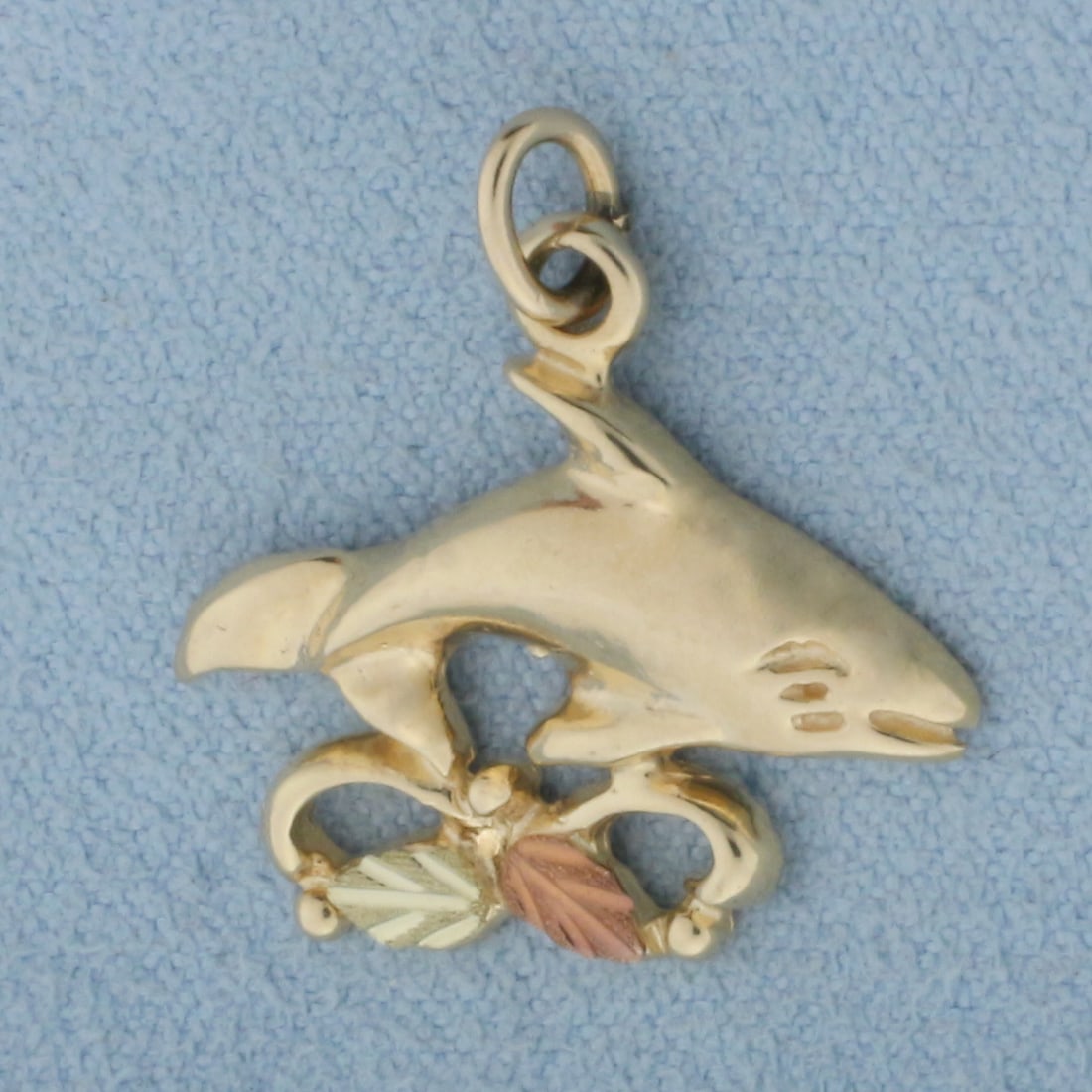 Orca Charm or Pendant in 10k Yellow and Rose Gold: In 10k yellow gold. 3/4 inch long and 3/4 inch wide. 1.8g.