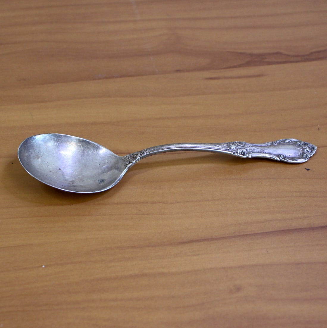 International "Wild Rose" Sterling Silver Round Bowl Soup Spoon: In .925 Sterling Silver. Contains one round bowl cream soup spoon. 6 inches long. 36.3g.