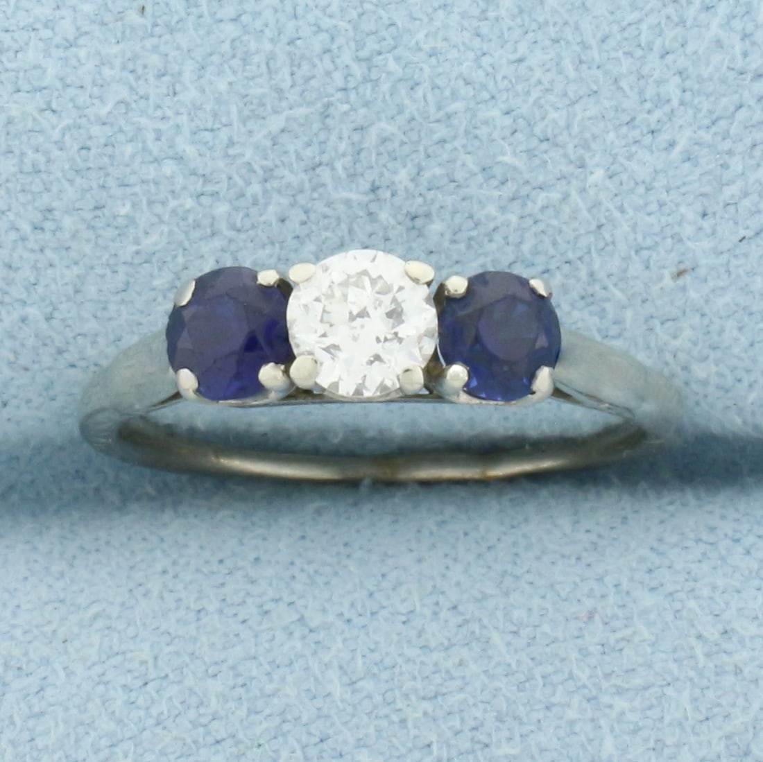 Diamond and Sapphire 3-Stone Ring in 14k White Gold: In 14k White Gold. Contains one high quality .1/3ct diamond, I color/I clarity, eye clean, great cut for lots of sparkle. Also contains two natural high quality natural 4mm sapphires with intense colo