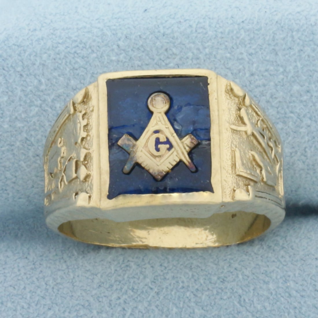 Vintage Masonic Ring in 10k Yellow Gold: In 10k Yellow Gold. 13.5mm wide at top. Blue enamel and blue crystal detail. Crystal does have some chipping/cracking, indicative of age. Size 9.5. 9.3g.