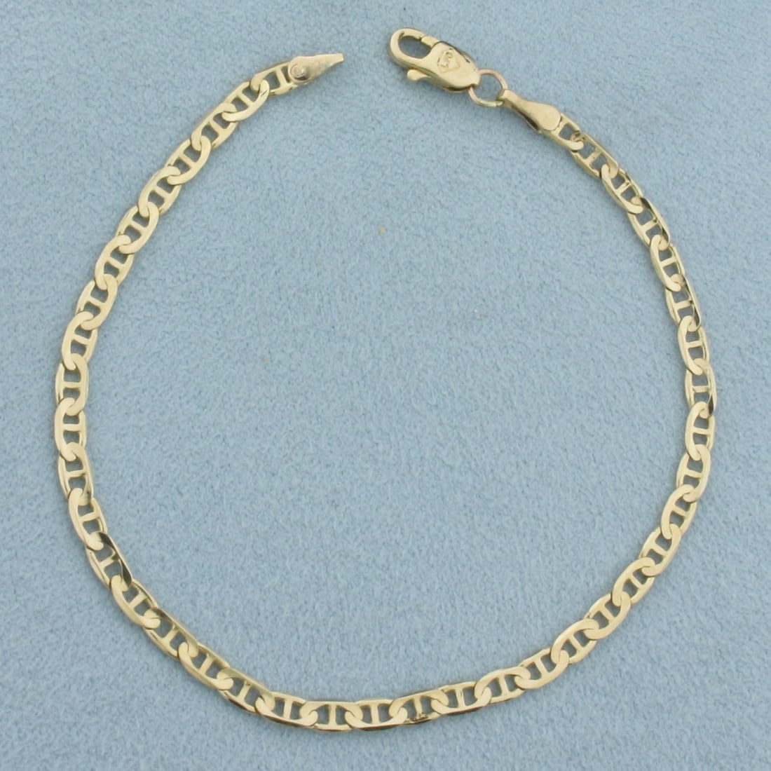 Italian Anchor Mariner Link Bracelet in 14k Yellow Gold: In 14k Yellow Gold. 7 inches long. 3mm wide. Italian made. Lobster clasp. 3.0g.