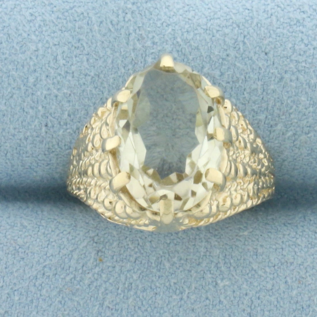 Citrine Solitaire Ring in 10k Yellow Gold: In 10k Yellow Gold. Contains one high quality natural 14x10mm fancy oval cut Citrine gemstone, approximately 5cts, with bright color and excellent clarity. Size 7.5. 5.5g.