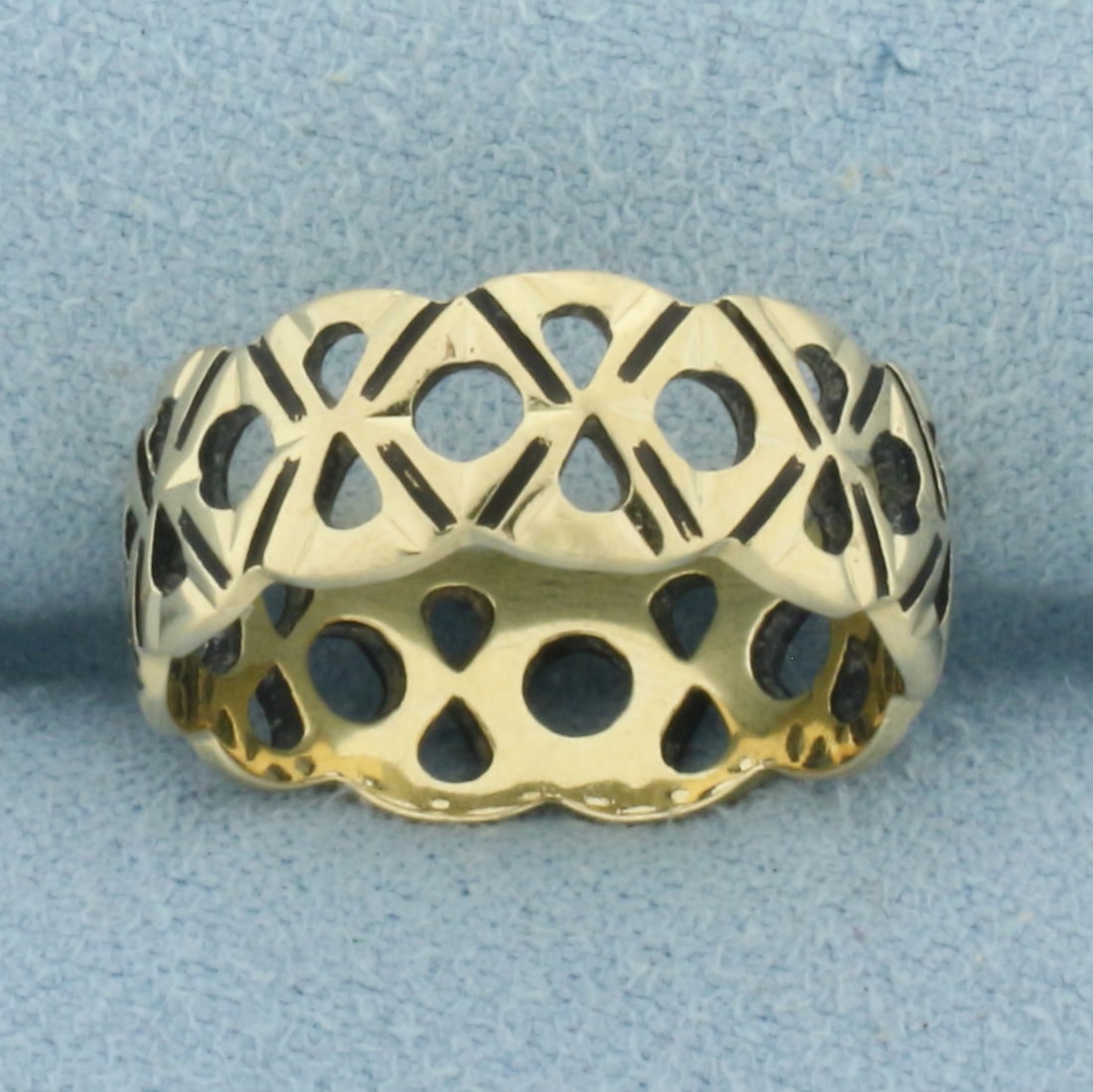 Black Enamel Cut Out Band Ring in 14k Yellow Gold: In 14k Yellow Gold. 7mm wide. Size 6.5. 3.4g.