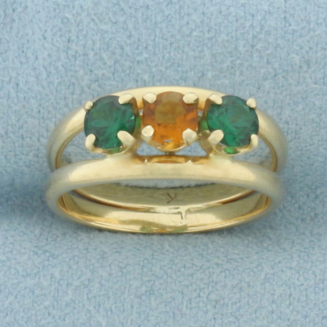 Green Garnet and Citrine Ring in 14k Yellow Gold: In 14k Yellow Gold. Contains two 4mm Green Garnet and one 4mm high Citrine high quality natural gemstones with vibrant color and excellent clarity. 7.4mm wide at top of ring. Size 5. 3.5g.