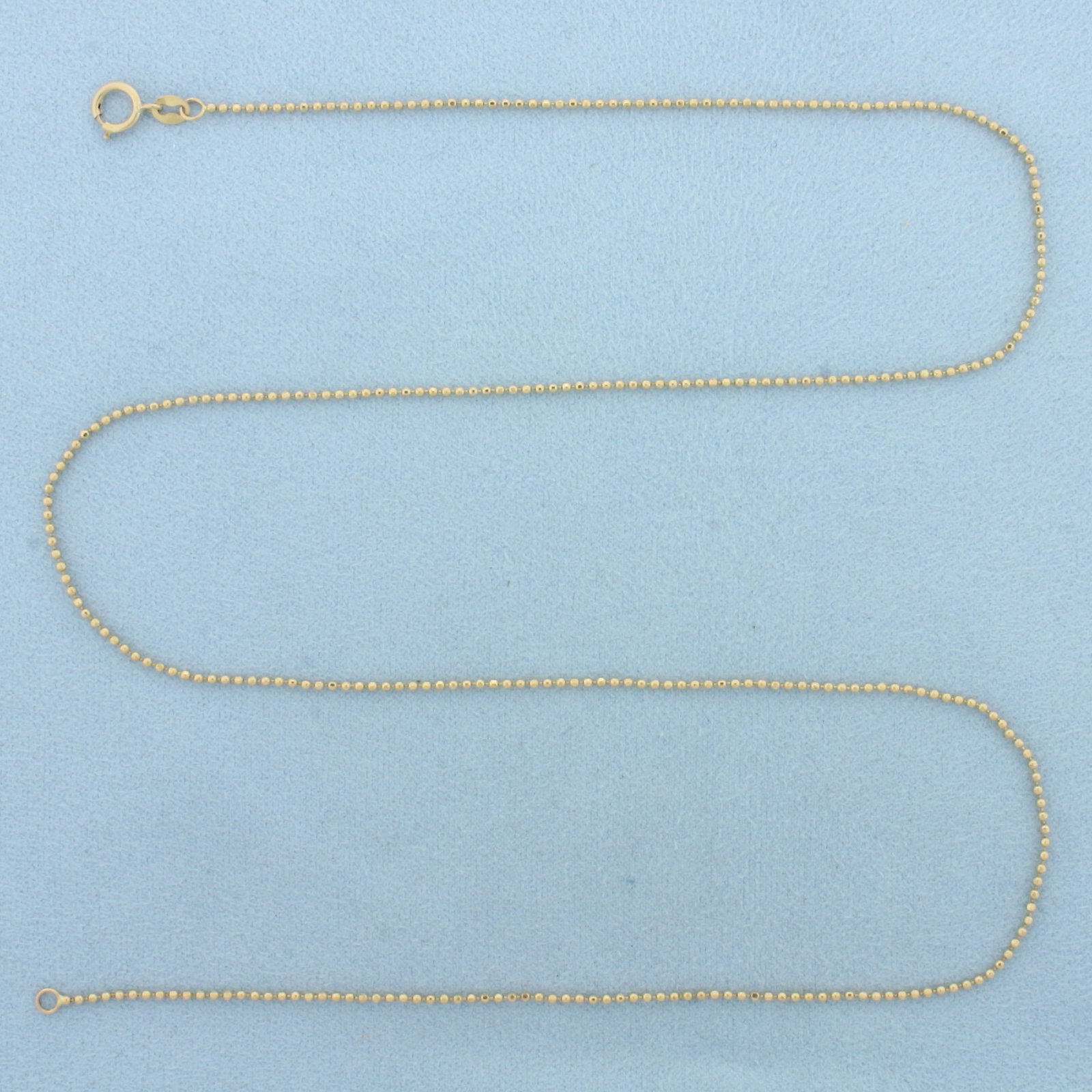 20 Inch Italian Ball Bead Chain Necklace in 14k Yellow Gold: In 14k Yellow Gold. 20 inches long. 1.2mm wide. Italian made. Spring clasp. 2.8g.