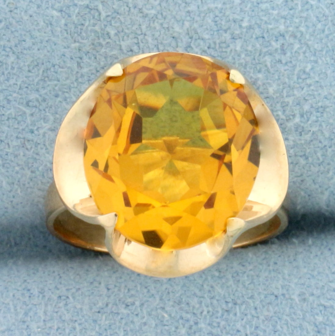 8ct Lab Yellow Sapphire Solitaire Ring in 18k Yellow Gold: In 18k yellow gold. Contains a high quality lab oval shaped 14mmx12mmyelllow Sapphire gemstone with fantastic golden yellow color and excellent clarity. Size 5 1/2. 4.7g.