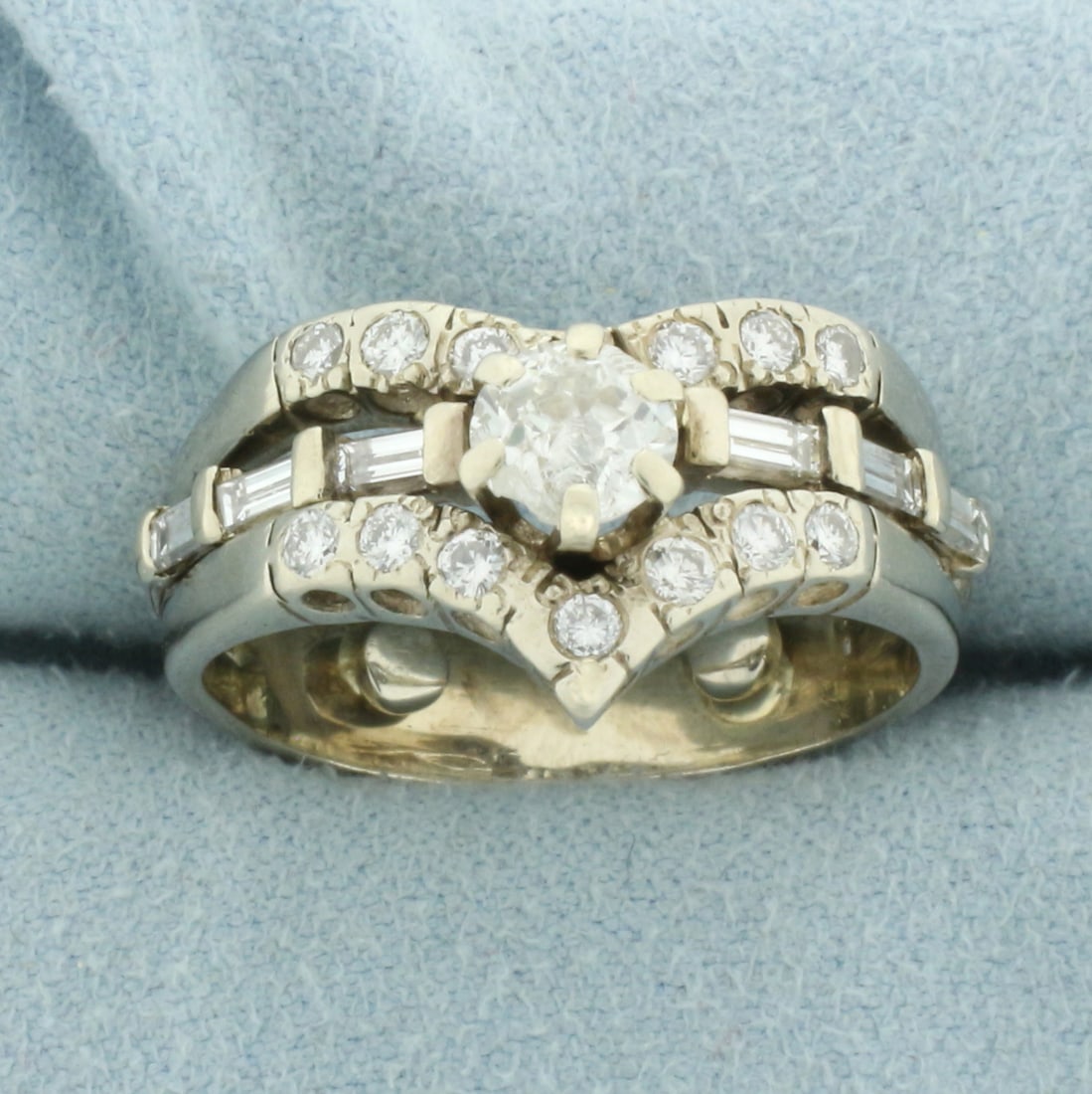 Vintage Baguette and Round Old European Diamond Engagement Ring in 14k Yellow Gold: In 14k white gold. Center diamond is high quality 1/2 ct Old European Cut, VS clarity/H color. Diamond has small chip, indicative of age. Accented by 13 round and six baguette diamonds, 1/2ct TW, of s