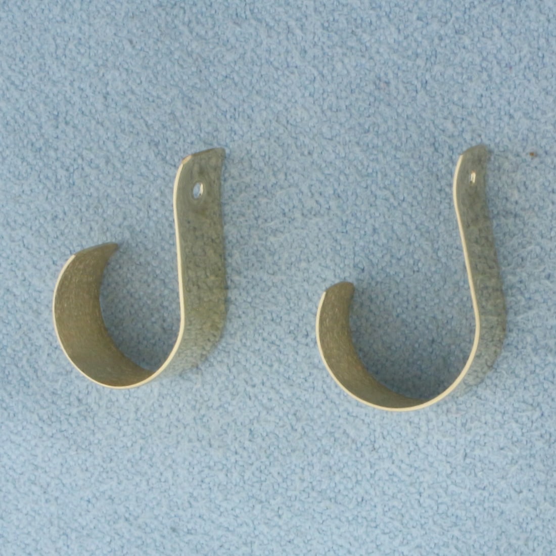 J-Hoop Stud Earring Enhancers in 14k Yellow Gold: In 14k Yellow Gold. 5/8 inch long. 6mm wide. Made to go with diamond stud earrings to give a new look. 1.3g.