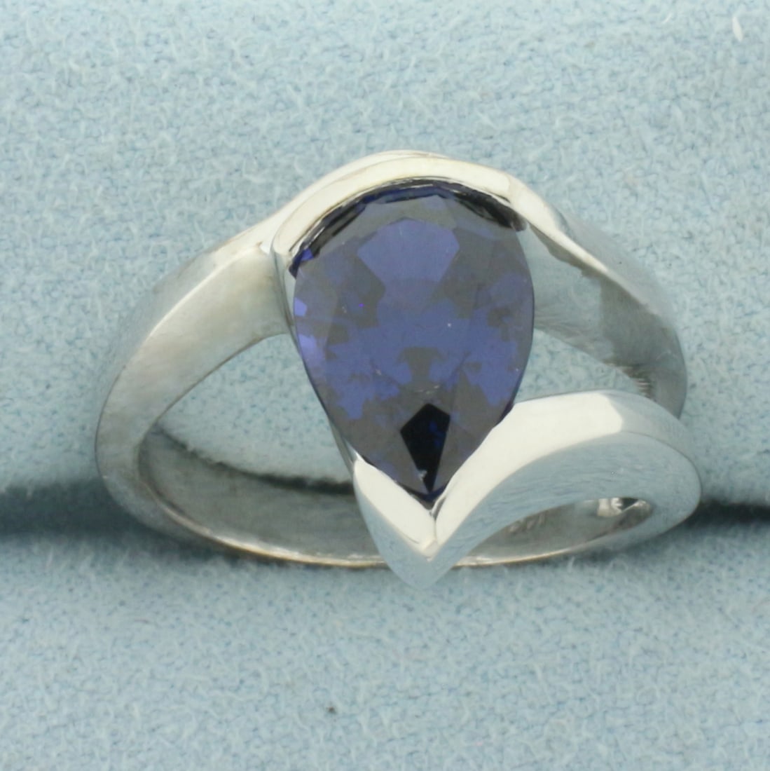 Pear Lab Sapphire Ring in 14k White Gold: In 14k White Gold. Contains one 12x8mm high quality Lab Sapphire gemstone, approximately 4cts, with intense color and excellent clarity. Size 8. 10.1g.