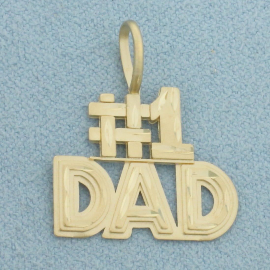 Number One #1 Dad Pendant in 14k Yellow Gold: In 14k Yellow Gold. 7/8 inch long (including bale). 3/4 inch wide. 1.3g.