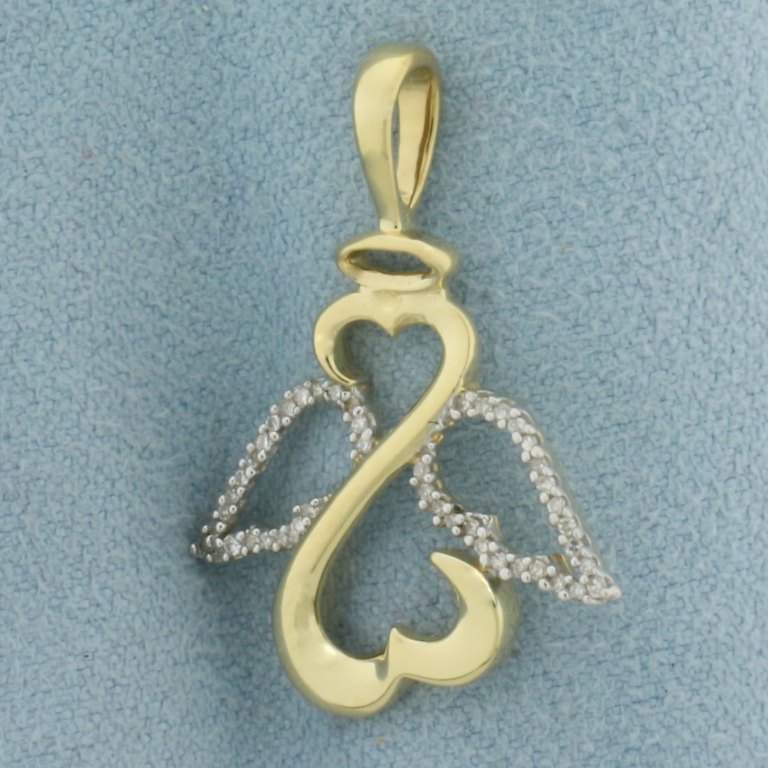 Diamond Open Hearts Angel Pendant in 14k Yellow Gold: In 14k Yellow Gold. Contains forty-six high quality 1/pt diamonds. 1 1/8 inch long. 3/4 inch wide. 2.4g.