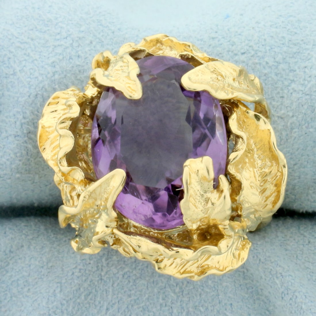 Designer Amethyst Leaf Design Statement Ring in 14K Yellow Gold: In 14K Yellow Gold. Contains one high quality natural 18x13mm oval cut Amethyst gemstone, approximately 10ct, with vibrant purple color and excellent clarity. Size 7 1/2. 17.0g