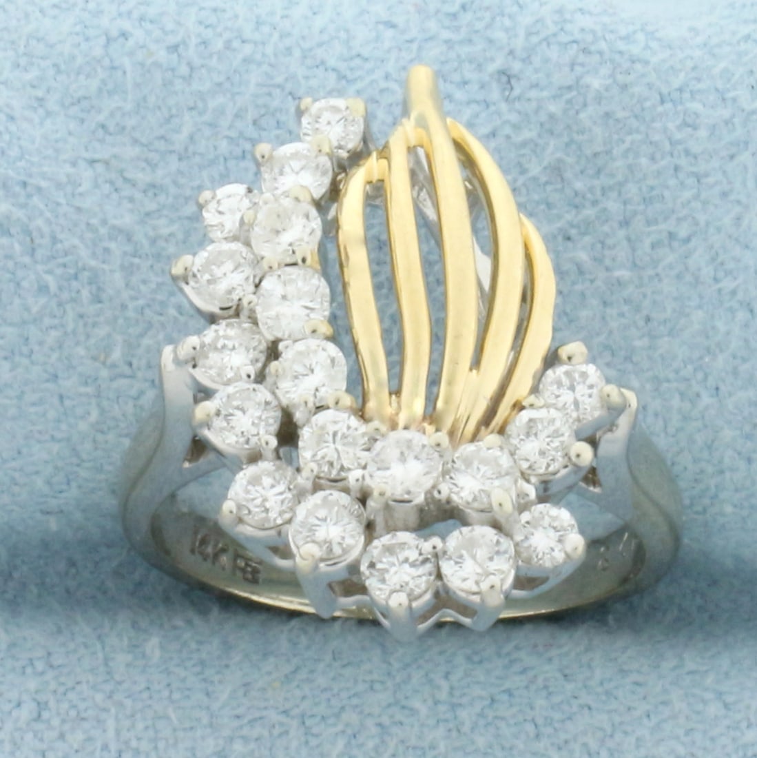 Flame Design Diamond Ring in 14k Yellow Gold: In 14k yellow and white gold. Contains Nineteen diamonds, 1ct TW, SI clarity/H color. Size 5. 4.6g.
