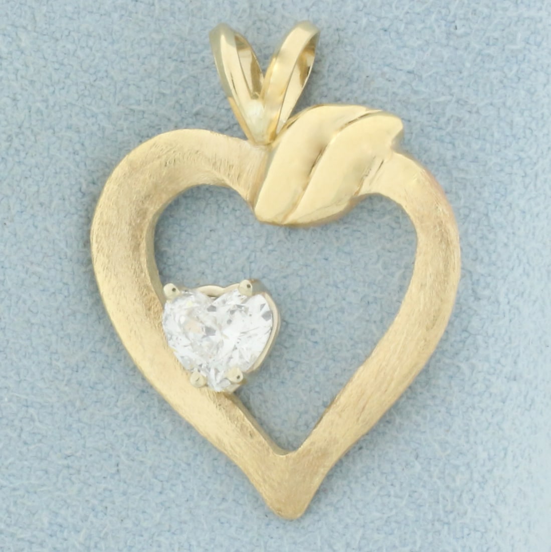Heart Shaped Diamond Pendant in 14k Yellow Gold: In 14k yellow gold. Contains one high quality 2/3ct heart shaped diamond, G color/I clarity, eye clean and great cut for lots of sparkle. Satin and high polish finish. 1 inch long x 7/8 inches wide. 3