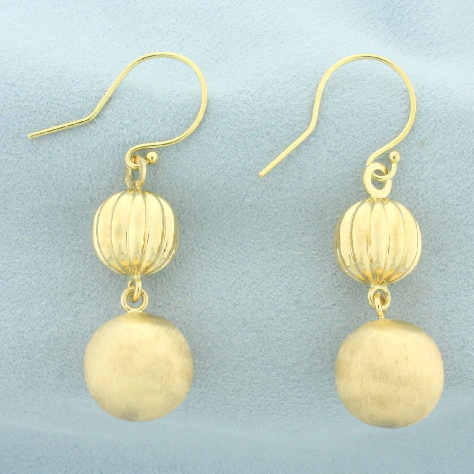 Italian Ball Bead Drop Dangle Earrings in 18k Yellow Gold: In 18k yellow gold. Italian made. 1 7/8 inches long and 14mm wide (large bead). High polish and brushed satin finish for unique look. Wire hooks. 8.4g.