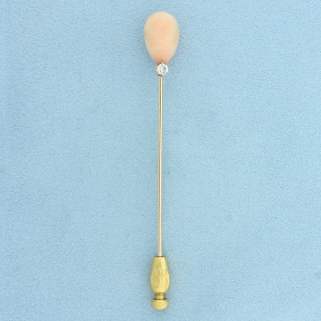 Vintage Angel Skin Pink Coral and Diamond Stick Pin in 14k Yellow Gold: In 14k yellow gold. Contains one high quality 10mm Angel Skin Coral Gemstone with beautiful pink color. Also contains one high quality 1/8ct Old European Cut diamond, G color/I clarity. 3 inches long 