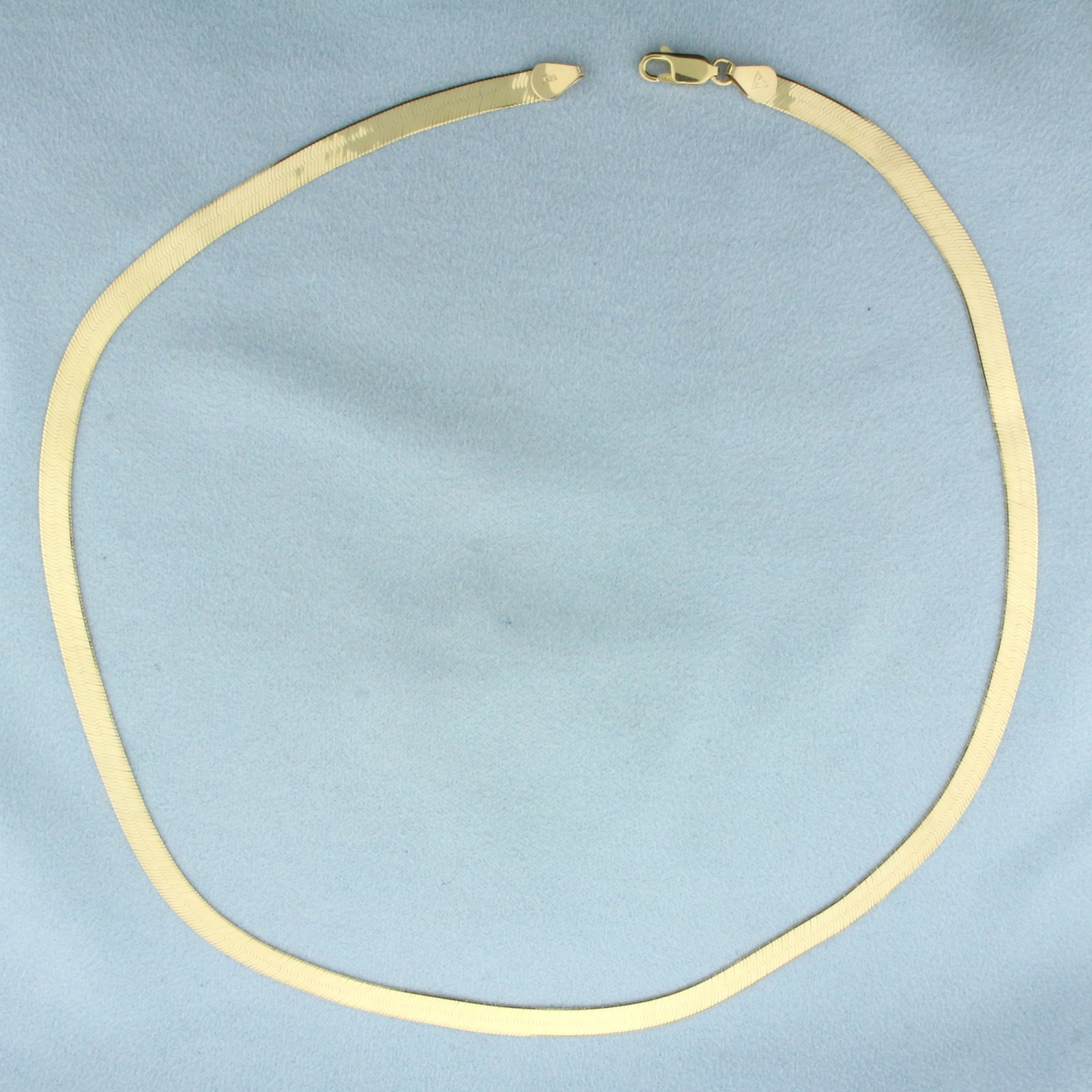 Liquid Gold Herringbone Chain Necklace in 14k Yellow Gold: In 14k yellow gold. 18 inches long, 5mm wide. Lobster clasp. 9.4g.