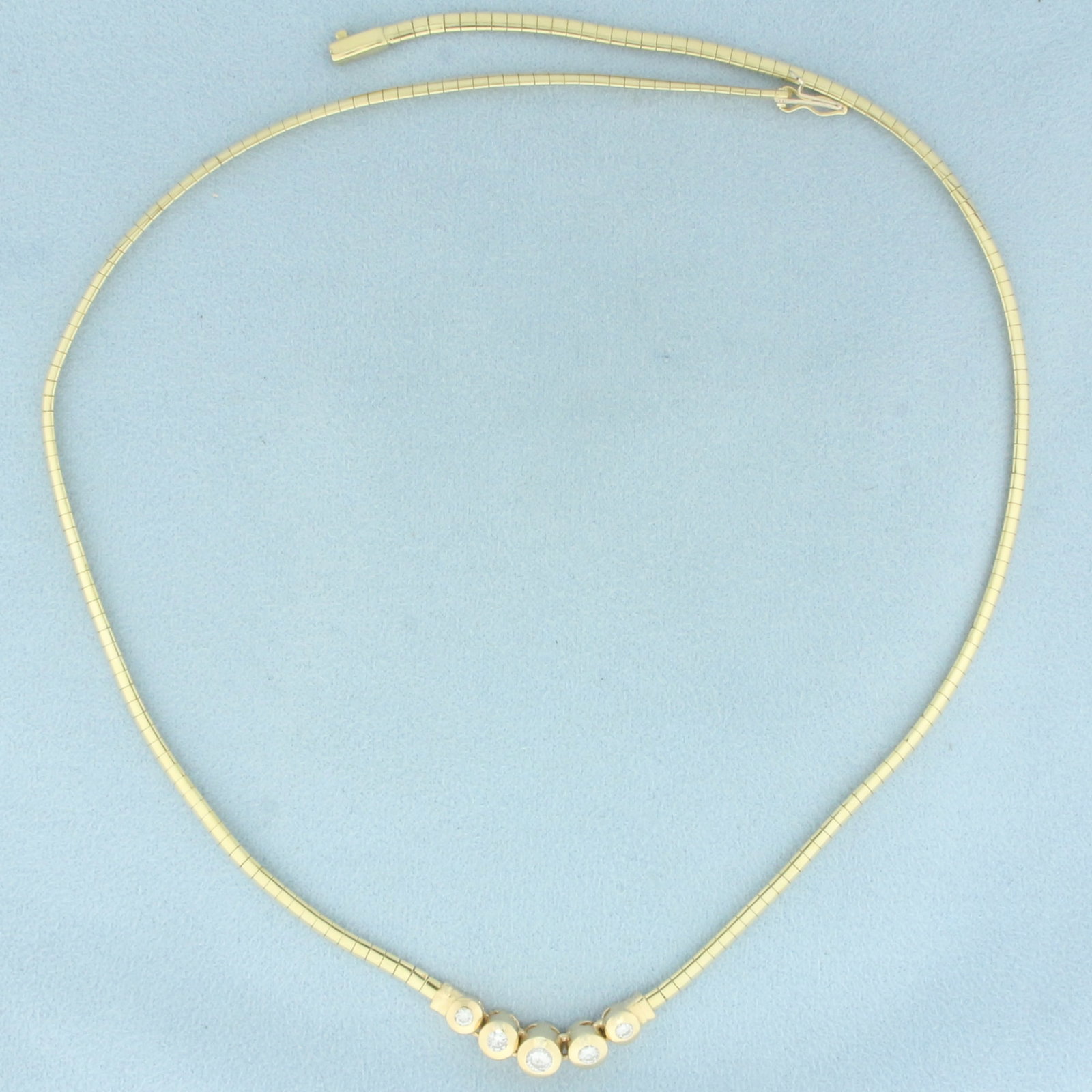 Italian Diamond Omega Necklace in 14k Yellow Gold: In 14k yellow gold. Italian made. Contains one .2ct, two .15ct, and two .07ct high quality diamonds, SI clarity/H color. 18 1/4 inches long, 2.7mm wide. Slide clasp with safety latch. 17.1g.