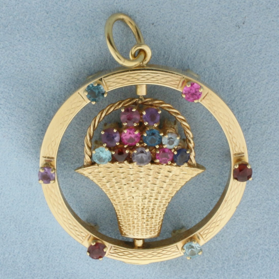 Large Rotating Pearl and Gemstone Flower Bouquet Pendant in 14K Yellow Gold: In 14k yellow gold. 2.2 inches long (including bail) by 1.6 inches wide. Center flower bouquet can rotate within circle. Contains seventeen 3mm high quality cultured pearls with high luster. Also cont
