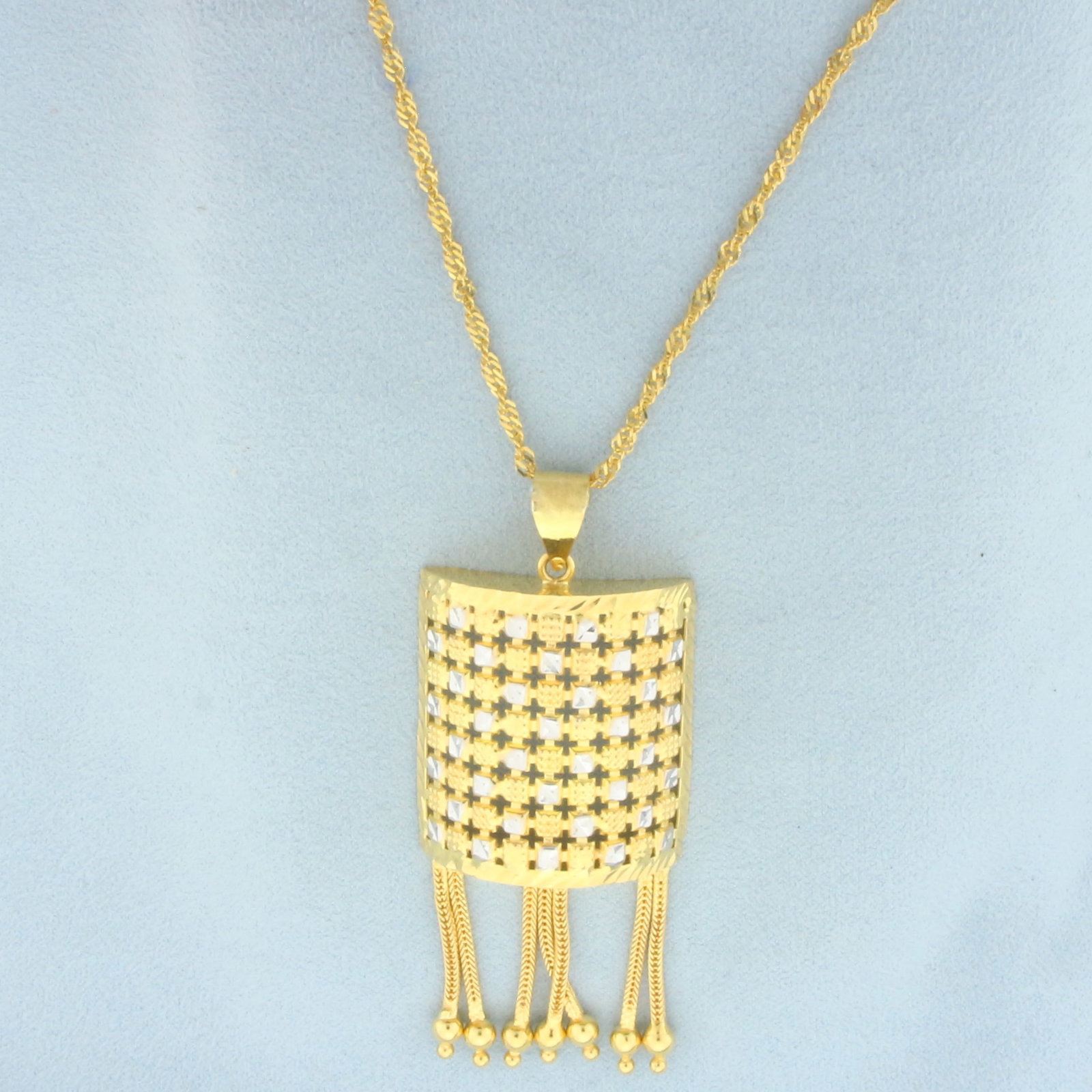 Diamond Cut Two Tone Dangle Necklace in 21k Yellow and White Gold: In 21k Yellow and White Gold. 2 3/4 inch long by 1 1/8 inch wide pendant. 15 1/2 inch long, 2.5mm wide twisting curb link chain. Never worn. Spring clasp. 14.3g.