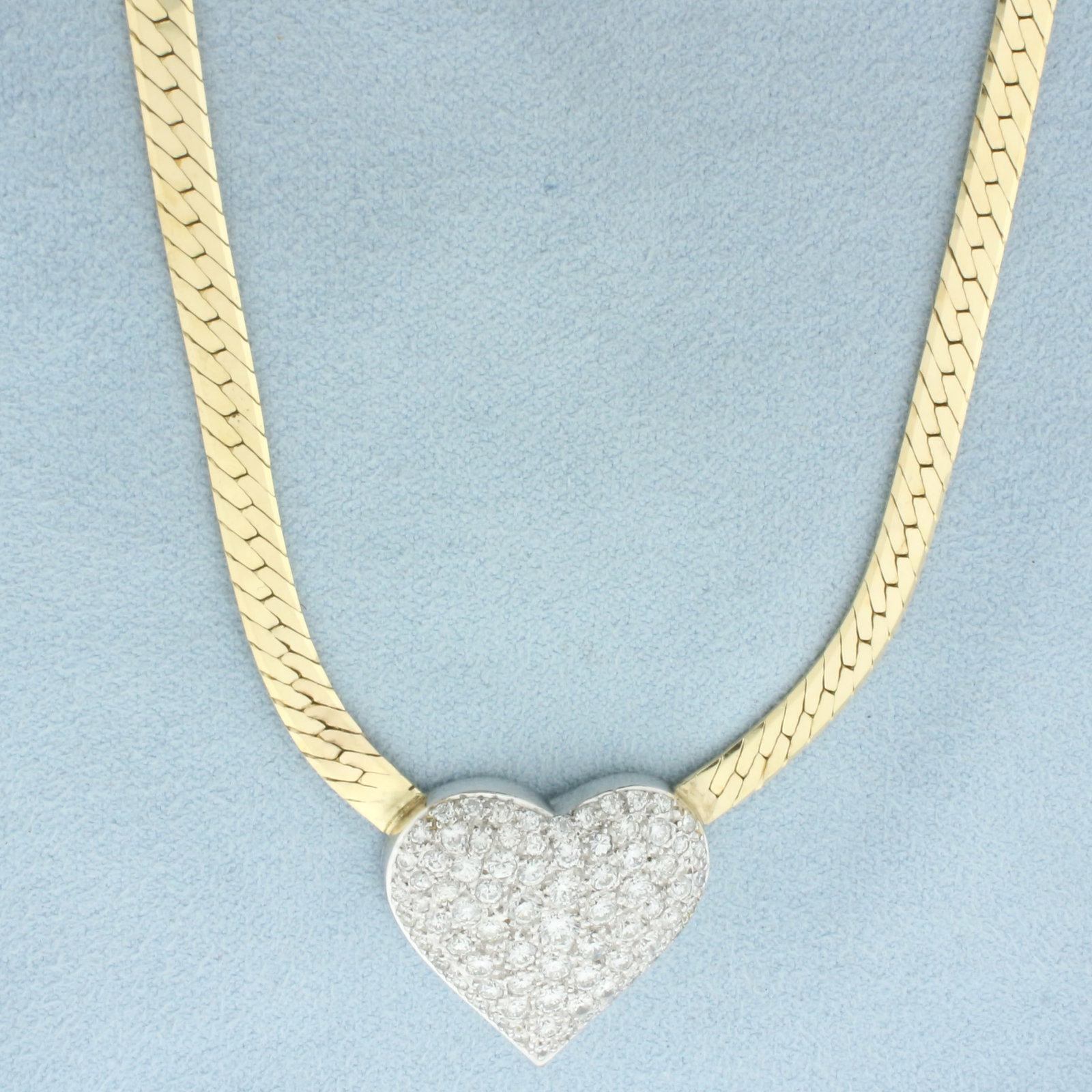 Italian 3ct Pave Diamond Heart Necklace in 14k Yellow Gold: In 14k Yellow Gold. Contains seventy-seven high quality diamonds, VS clarity/G color. Pave set. 18 inches long, herringbone link chain 4mm wide. Heart 1inch by 1 inch. Italian made. Slide clasp with