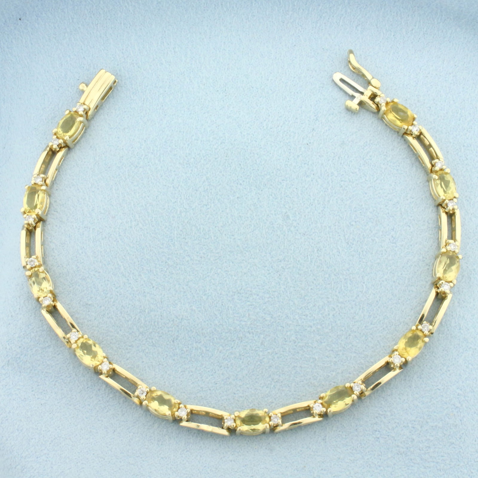 Citrine and Diamond Tennis Bracelet in 14k Yellow Gold: In 14k Yellow Gold. Contains eleven high quality natural 6mm Citrine gemstones, approximately 5.5ct TW, with bright color and excellent clarity. Also contains twenty-two high quality diamonds, 1/4ct T