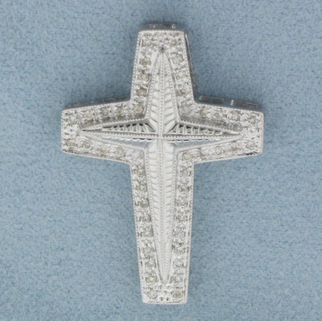 Diamond Pave Cross Pendant or Slide in 14k White Gold: In 14k White Gold. Contains forty-six high quality 1/2pt diamonds. 1 1/4 inches long. 7/8 inch wide. 3.8g.