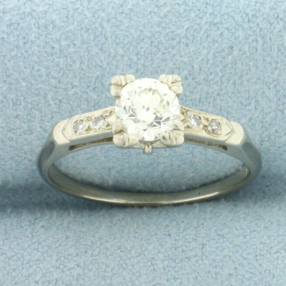 Antique Old European Diamond Engagement Ring in 14k White Gold: In 14k White Gold. Contains one high quality 2/3ct old European cut diamond, VS clarity/I color. Also contains four .01ct single cut diamonds of similar high quality. Size 7.5. 2.2g.