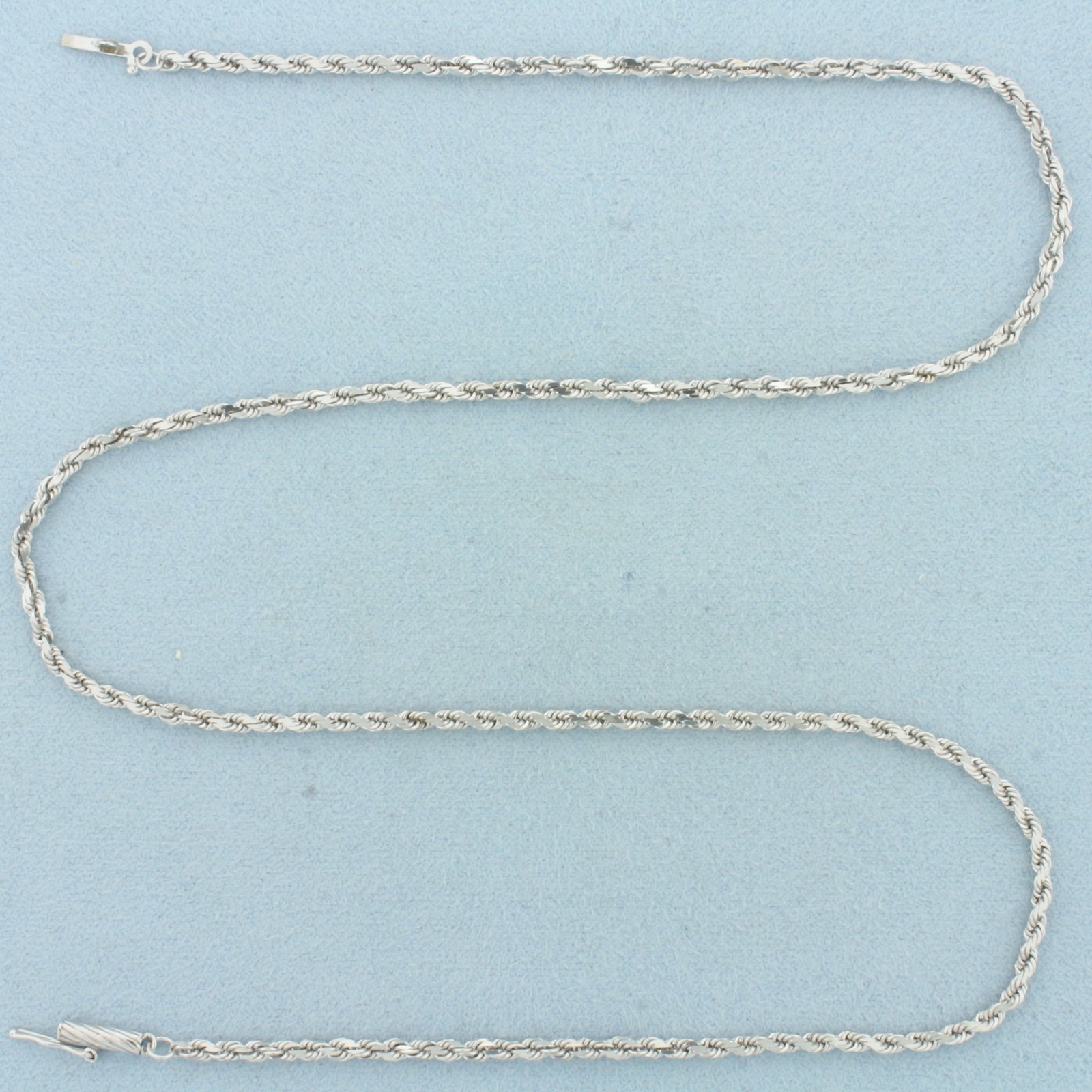 18 Inch Rope Link Chain Necklace in 14k White Gold: In 14k White Gold. 18 inches long. 2mm wide. Rope link. Slide clasp with safety latch. 7.9g.