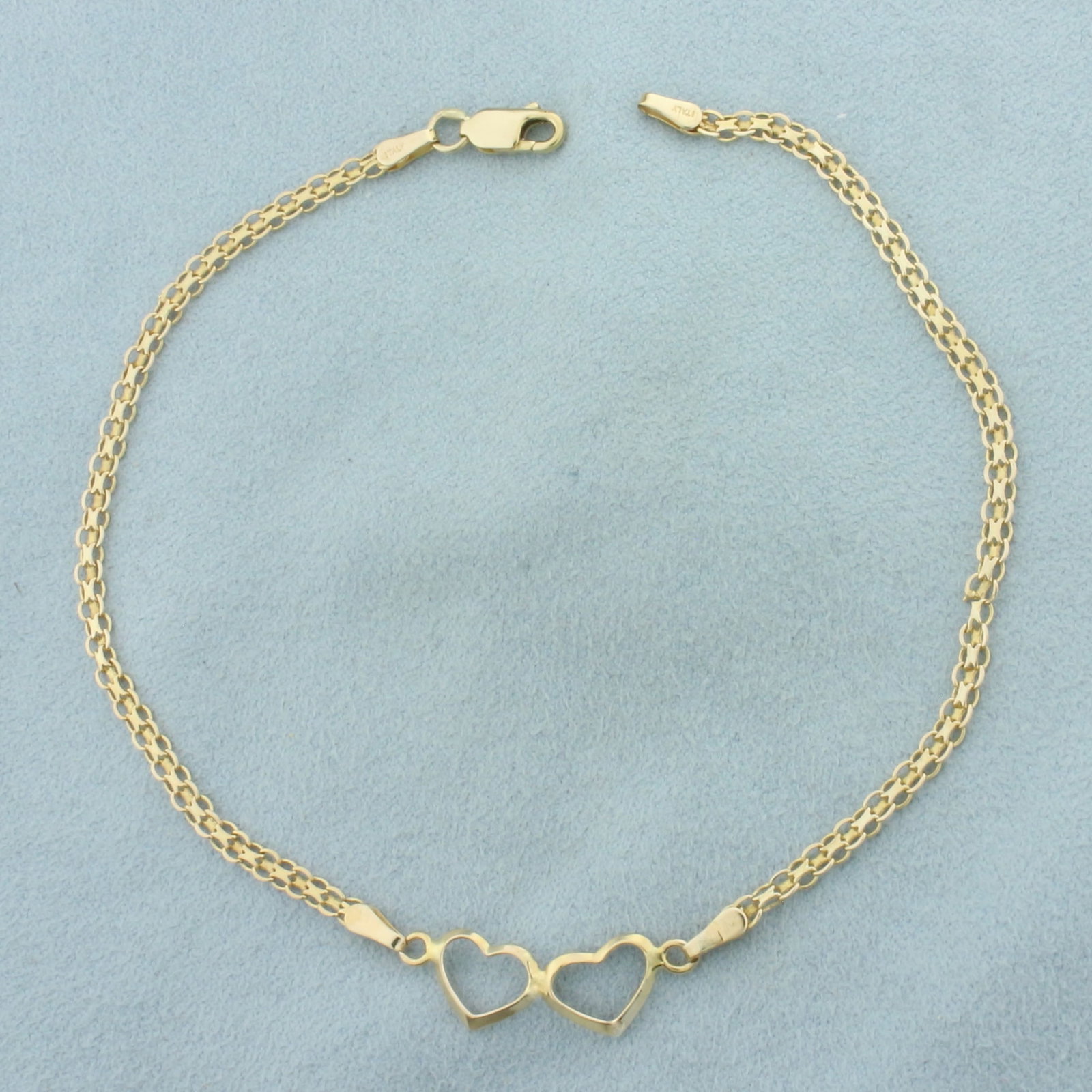 Heart Bismark Link Anklet in 14k Yellow Gold: In 14k Yellow Gold. 9 5/8 inches long. 1/4 inch wide at center. Lobster clasp. 3.2g.