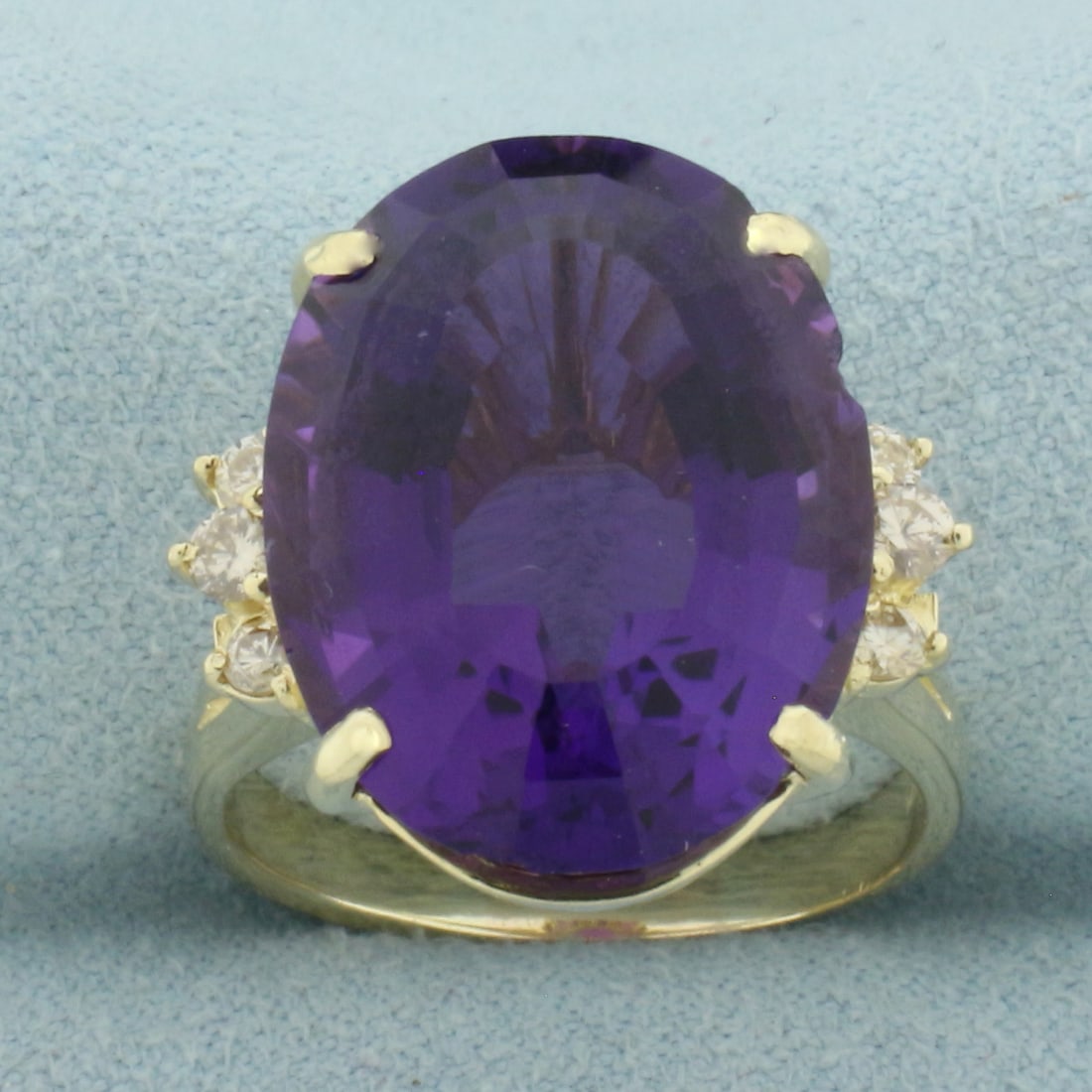 Amethyst and Diamond Statement Ring in 14k Yellow Gold: In 14k Yellow Gold. Contains one 20x15mm high quality oval fancy cut natural Amethyst gemstone, approximately 15cts, with intense color and excellent clarity. Also contains six high quality diamonds, 