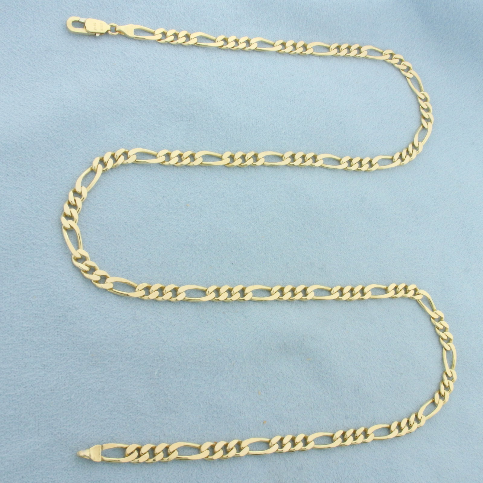20 Inch Italian Figaro Link Chain Necklace in 14k Yellow Gold: In 14k Yellow Gold. 20 inches long. 4.9mm wide. Italian made. Lobster clasp. 20.1g.