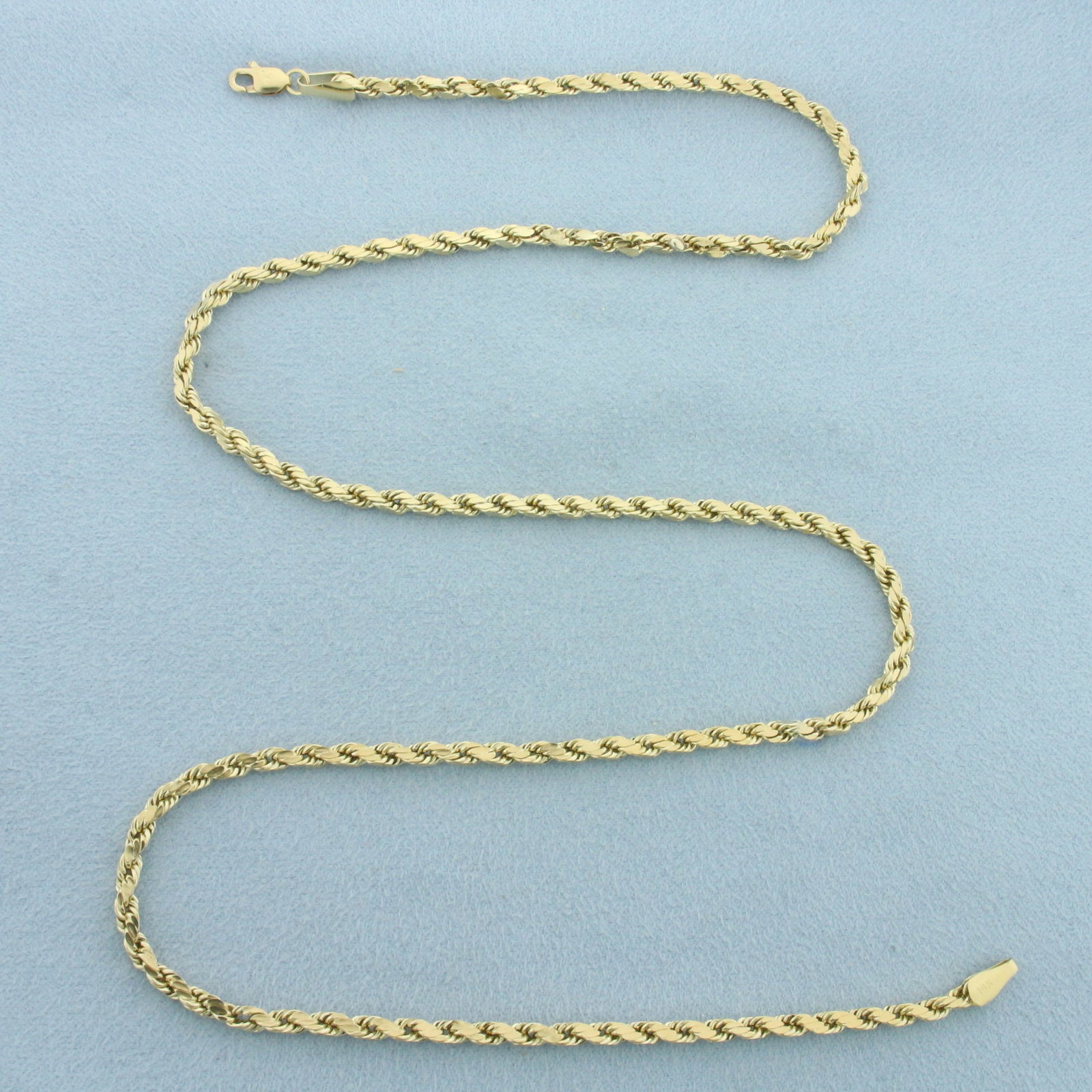 20 Inch Rope Link Chain Necklace in 14k Yellow Gold: In 14k Yellow Gold. 20 inches long. 3mm wide. Lobster clasp. 7.1g.
