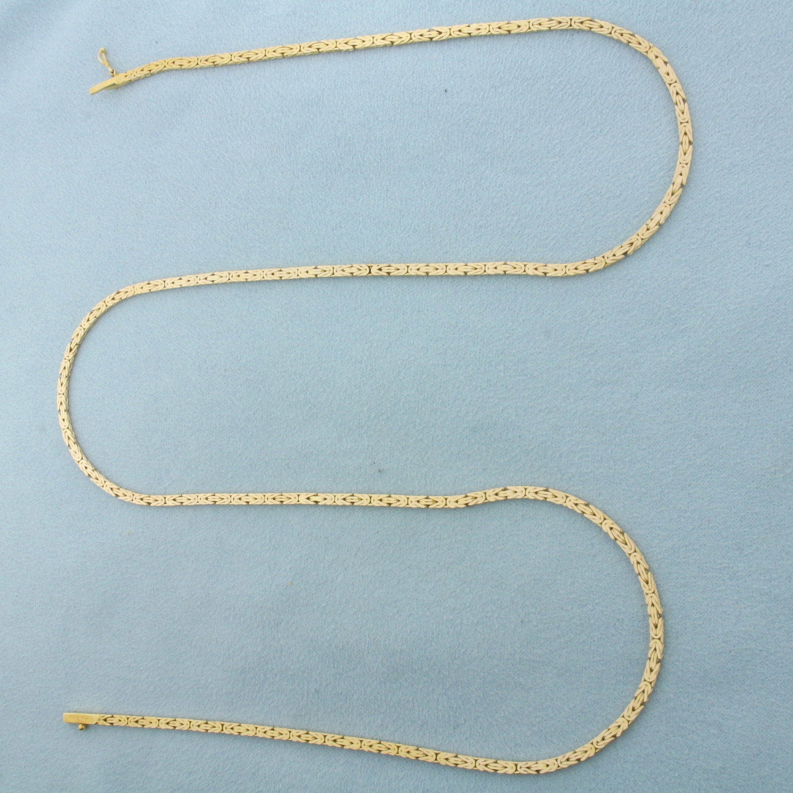 24 Inch Byzantine Link Chain Necklace in 14k Yellow Gold: In 14k Yellow Gold. 24 inches long. 2.4mm wide. Italian made. Slide clasp with safety latch. 15.2g.
