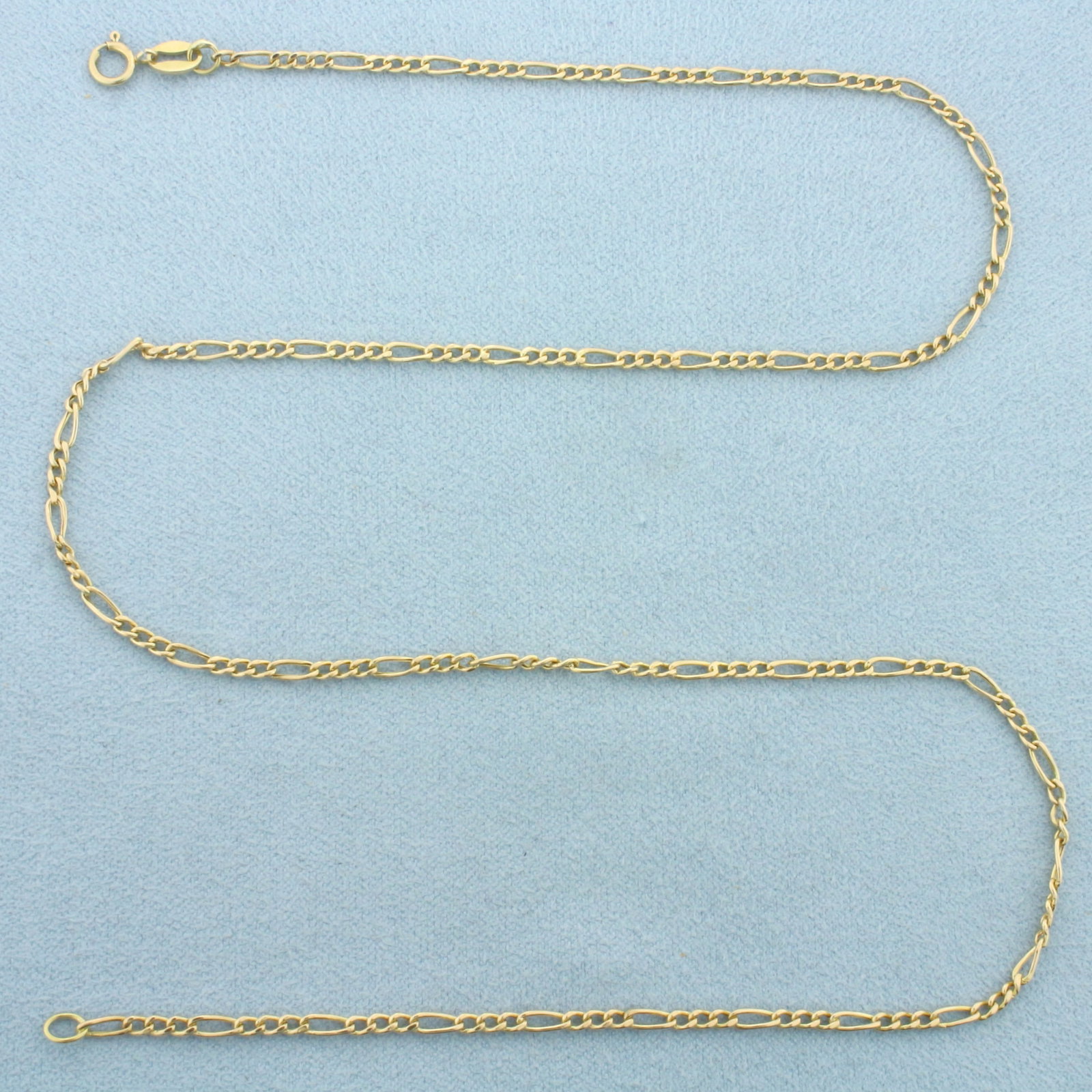 18 Inch Italian Figaro Link Chain Necklace in 14k Yellow Gold: In 14k Yellow Gold. 18 inches long. 2.2mm wide. Italian made. Spring clasp. 2.5g.