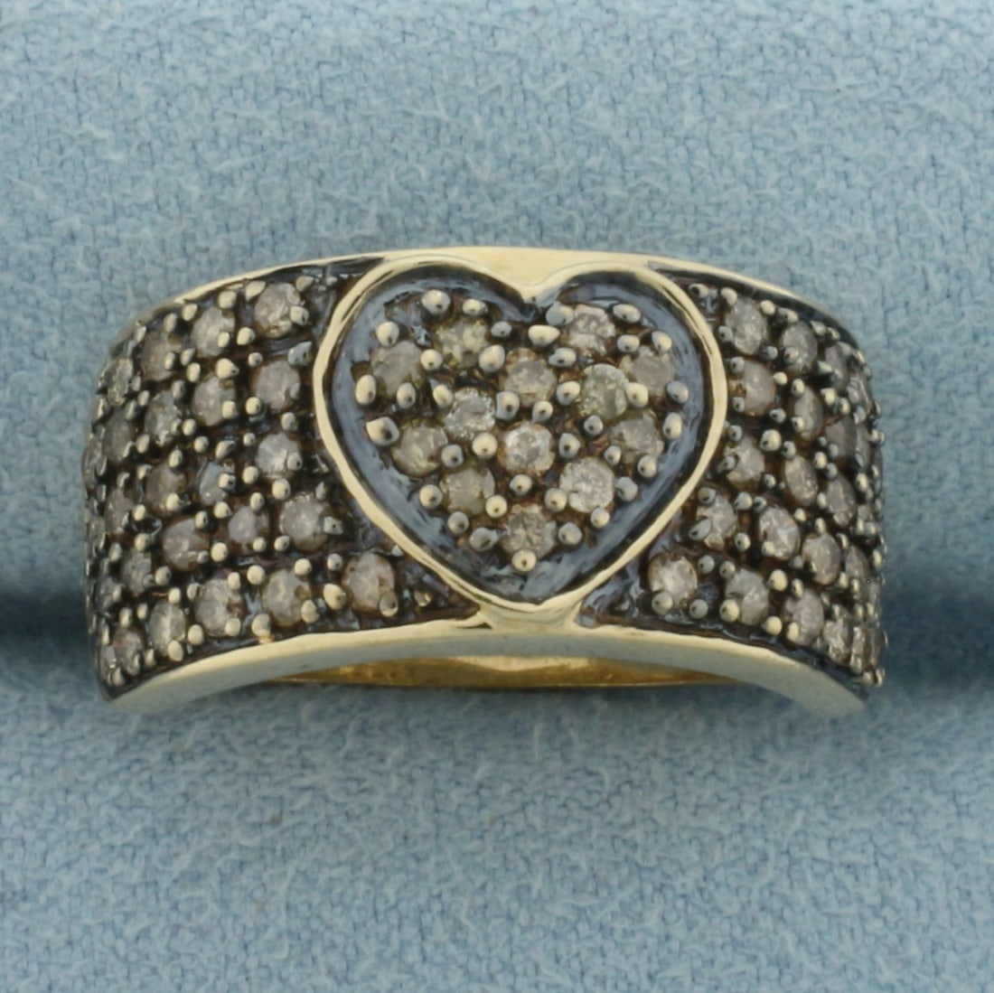 Cognac Diamond Pave Heart Ring in 10k Yellow Gold: In 10k Yellow Gold. Contains sixty-three .01ct high quality Cognac diamonds with warm color. Black rhodium design details. 11mm wide at top of ring. Size 8. 6.2g.