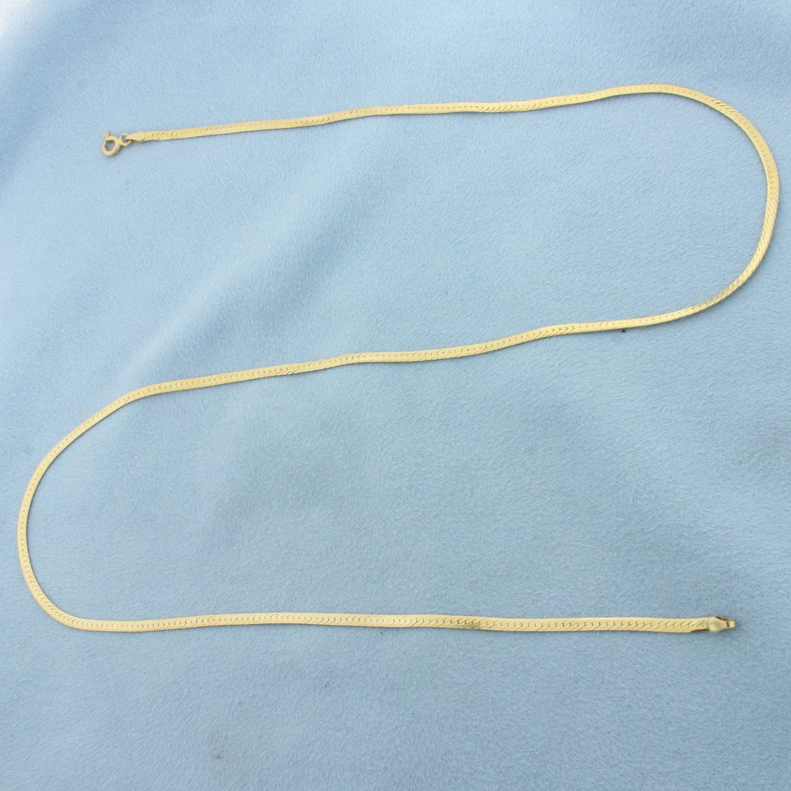 Reversible 20 Inch Herringbone Link Chain Necklace in 14k Yellow Gold: In 14k Yellow Gold. 20 inches long. 2.1mm wide. High polish on one side, textured finish on other. Spring clasp. 4.1g.
