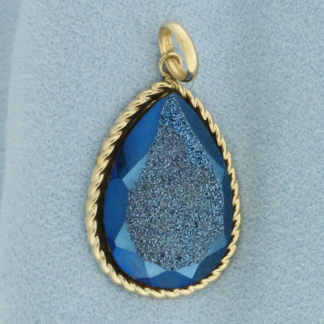 Blue Druzy Quartz Pendant in 14k Yellow Gold: In 14k Yellow Gold. Contains one 21x15.5mm high quality teardrop Blue Druzy Quartz gemstone with intense color. 1 1/8 inch long. 5/8 inch wide.