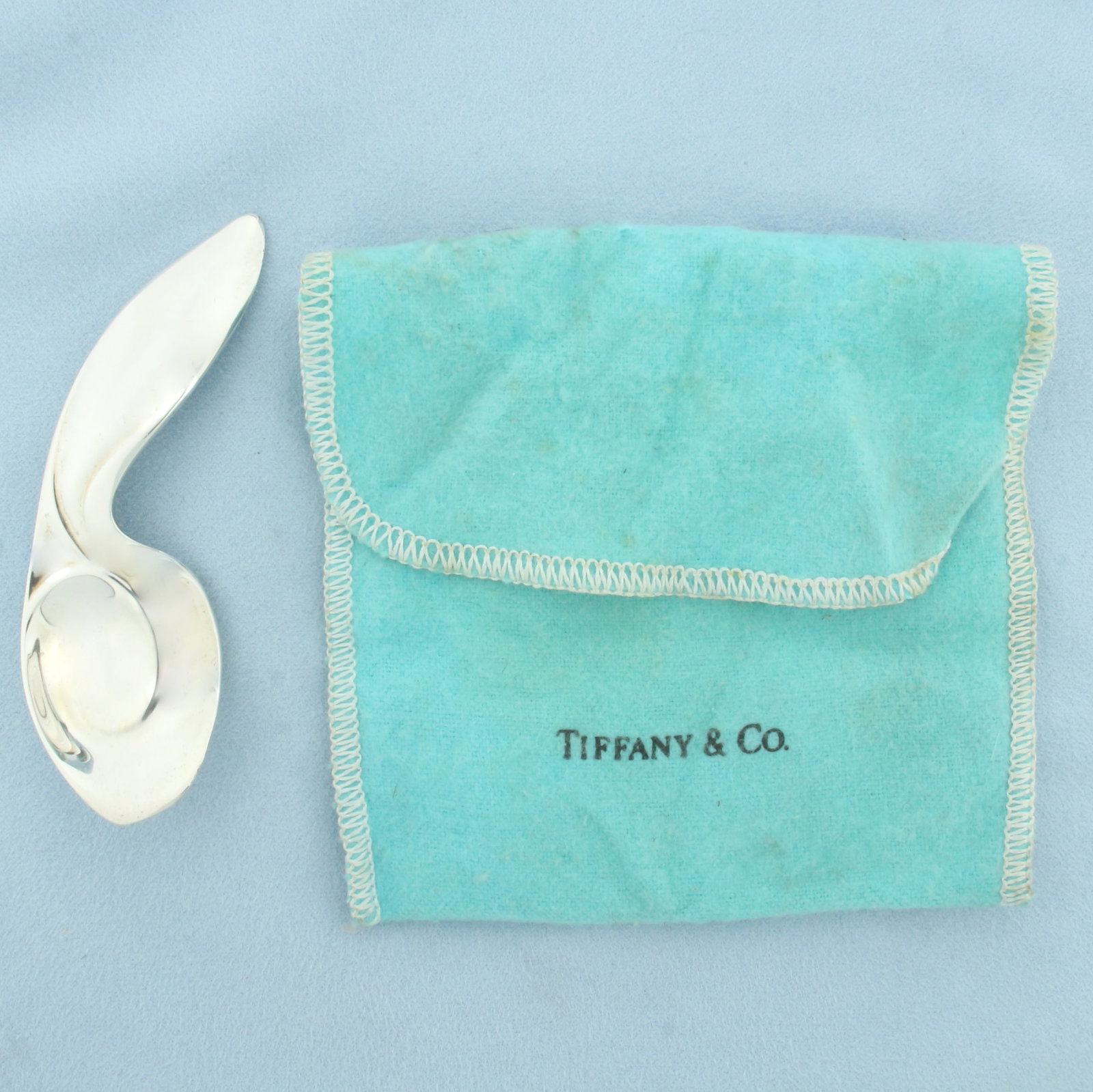 Tiffany and Co. Rabbit Ear Baby Spoon in Sterling Silver: In .925 Sterling Silver. 3.5 inches long. 1 1/8 inch wide. Original pouch included. 39.3g.