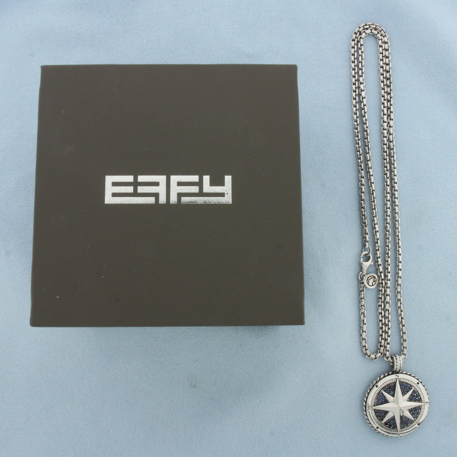 Effy Mens Sapphire Compass Rose Necklace in Sterling Silver: In .925 Sterling Silver. 1 1/4 inch long by 1 inch wide pendant accented with natural high quality Blue Sapphire gemstones with vibrant color and excellent clarity. 22 inches long chain. 2.6mm wide. L