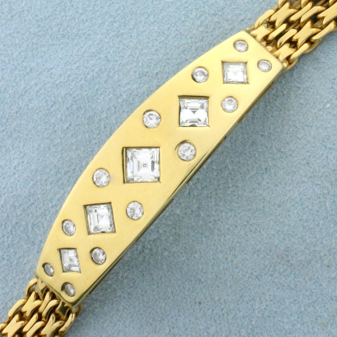 Designer 3ct Square Emerald and Round Diamond Bracelet in 18k Yellow Gold: In 18k yellow gold, containing 17 ultra high quality diamonds of VVS clarity/F color. Contains one .9ct, two .5ct, and two .25ct square emerald cut diamonds as well as four .07ct, .05ct, and .03ct rou