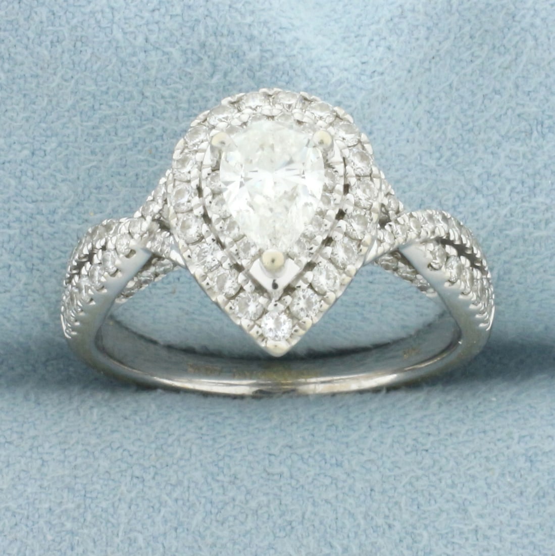 Vera Wang Love Collection Pear Diamond Double Halo Twist Engagement Ring in 14k White Gold: In 14k white gold. Center diamond is .7ct, I color/SI2 clarity. Comfort Fit. Accent diamonds create double halo and twist design,.95ct TW. Also accented with 2 high quality natural 1.8mm sapphire