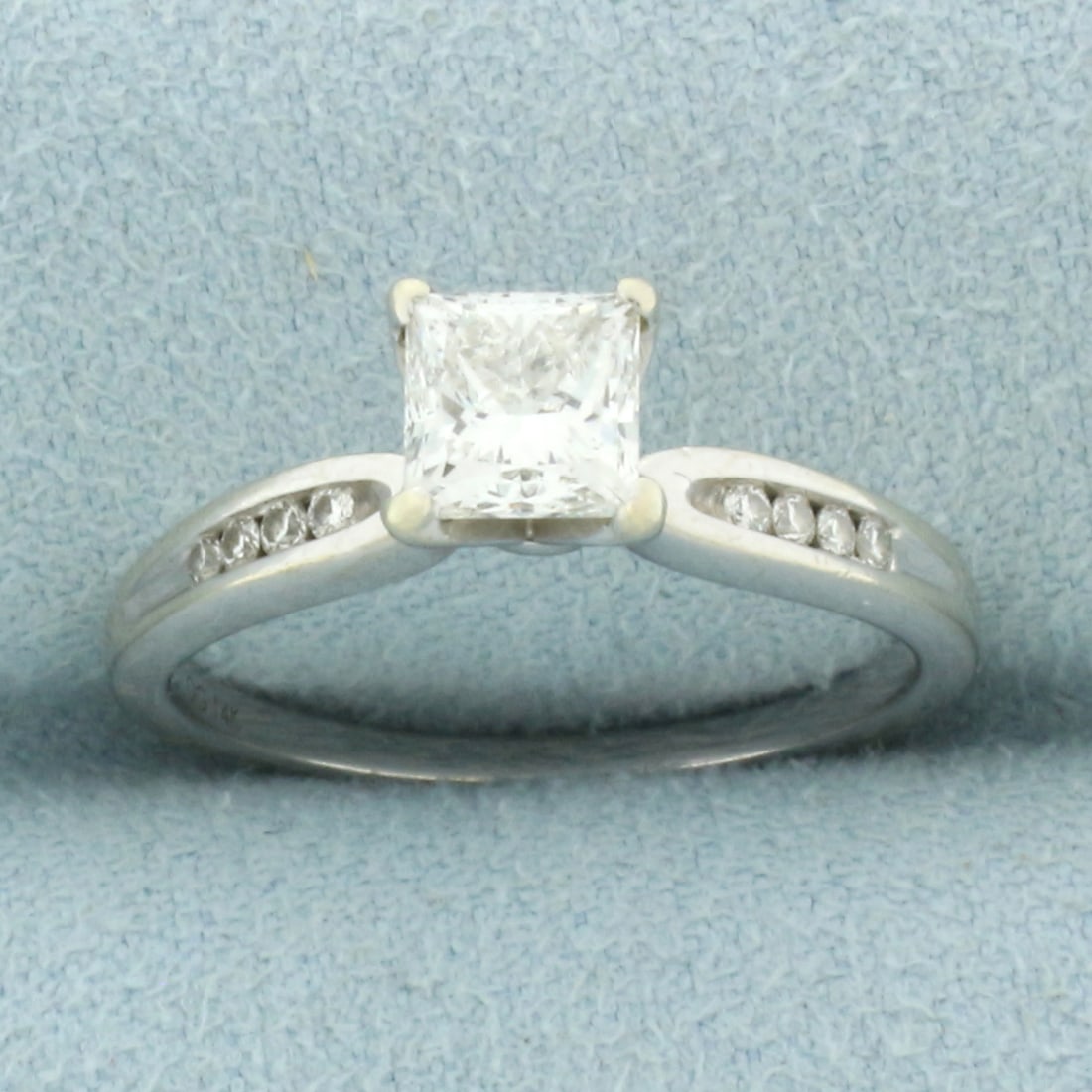 Certified Princess Diamond Engagement Ring in 14k White Gold: In 14k white gold. Center diamond is certified (GSI Report #46344900302) princess cut, .90ct, G color/SI2 clarity, eye clean, good cut for lots of sparkle. Certificate is included. Accented with 8