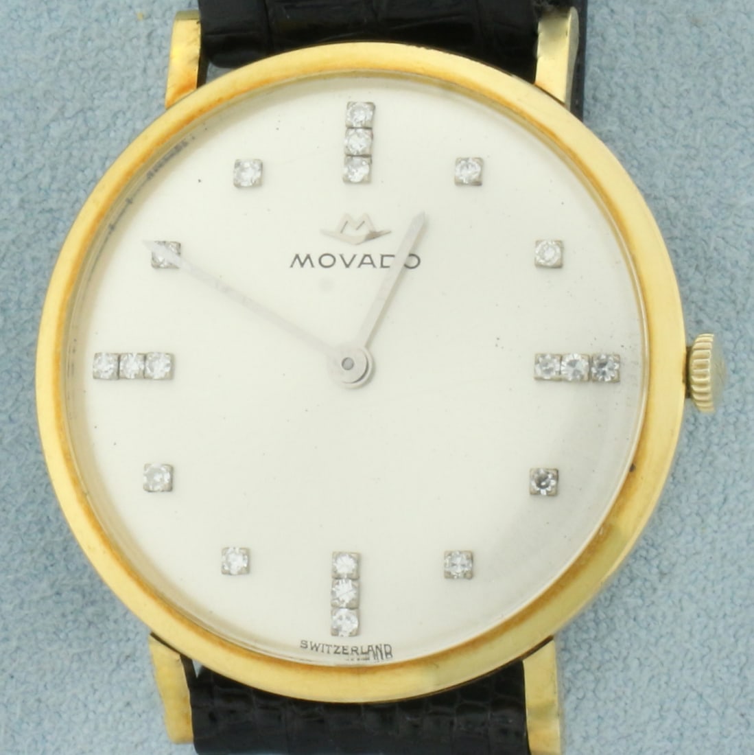 Vintage Mens Movado Diamond Dial Dress Watch in 18k Yellow Gold: Solid 18k yellow gold case. Swiss made. Ultra rare model, circa 1950. 32mm case. Diamonds hour markers. Leather strap. Windup movement runs great. Original crystal, minimal scratching. Overall