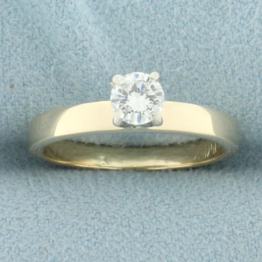 Diamond Solitaire Engagement Ring in 14k Yellow Gold: In 14k yellow gold. Contain, one high quality 1/3ct round brilliant diamond, VS clarity/H color, great cut for lots of sparkle . 4-prong head. 2.7mm band. Size: 5.5. 2.8g.