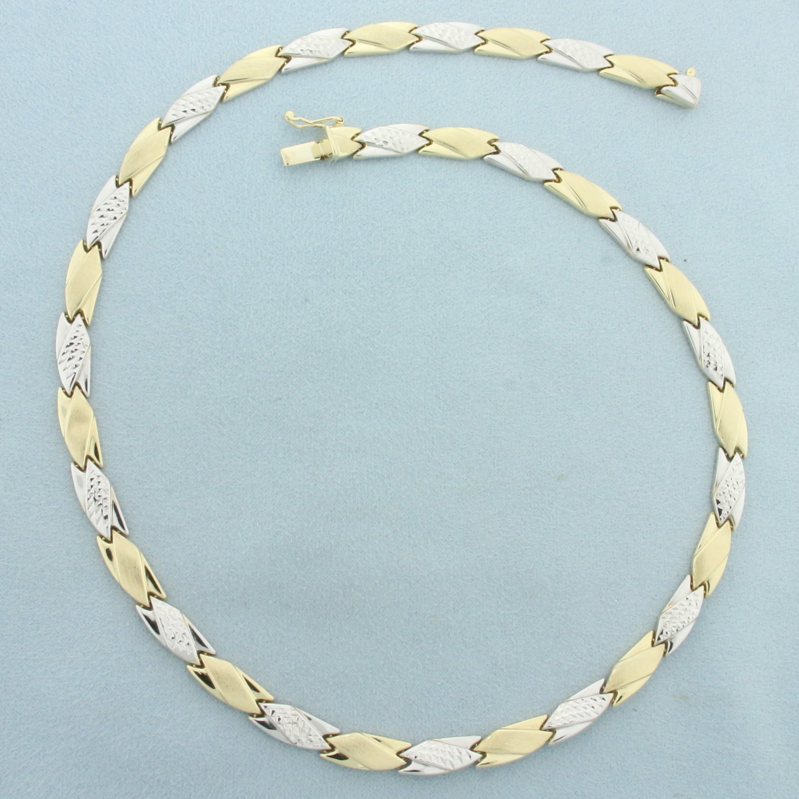 17 Inch Two Tone Diamond Cut Designer Link Necklace in 14k Yellow and White Gold: In 14k yellow and white gold. 17 inches long and 1/4 inch wide. Matte and polished finished on yellow gold, diamond cut on white gold gives a fantastic look.. Concealed slide clasp with safety latch. 