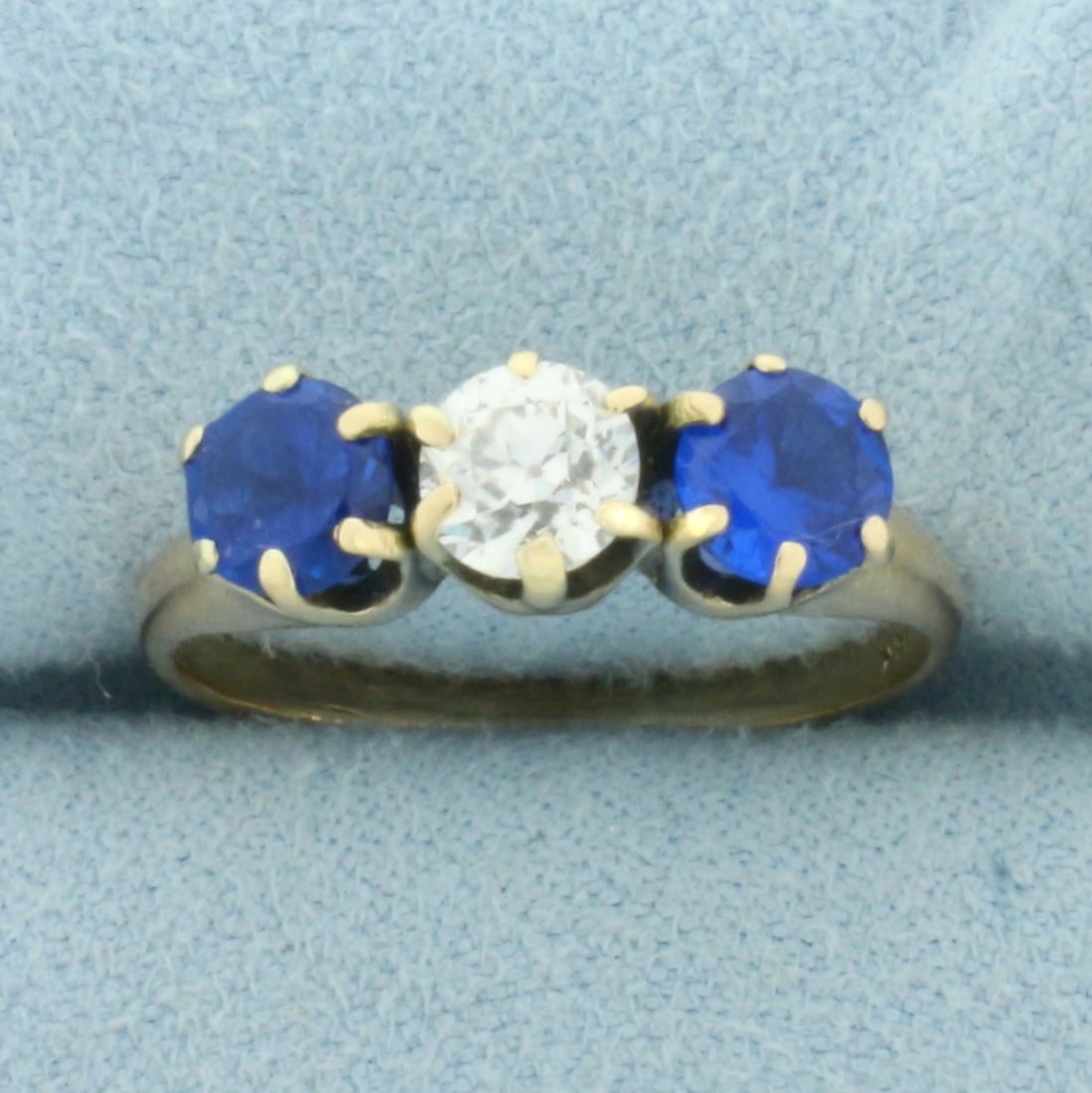 Antique Old European Diamond and Spinel 3-Stone Ring in 14k Yellow Gold: In 14k Yellow Gold. Contains one high quality .6ct European cut diamond, VS clarity/I color. Also contains two high quality .45ct Spinel gemstones with intense color and excellent clarity. Size 7. 3.1