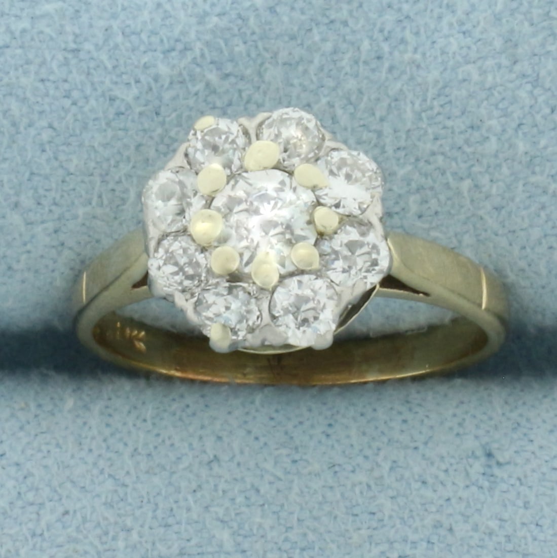 Antique Old European Cut Diamond Flower Ring in 14k Yellow Gold: In 14k Yellow Gold. Contains one .4ct and eight .07ct high quality Old European Cut diamonds, VS clarity/G color. 1ct TW. 9.7mm wide at center. Size 4.5.