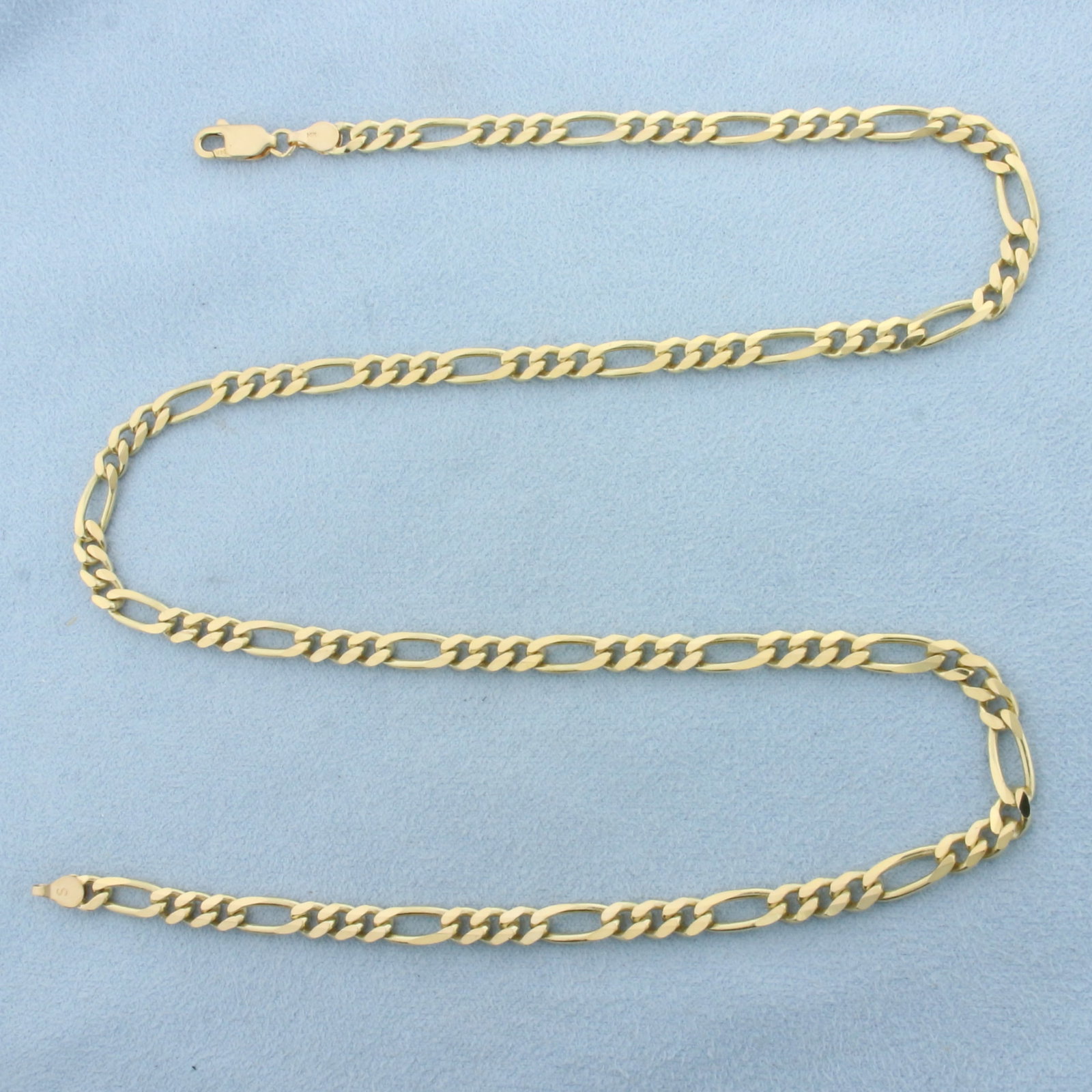 20 Inch Figaro Link Chain Necklace in 14k Yellow Gold: In 14k Yellow Gold.20 inch long. 4.5mm wide. Lobster clasp. 20.8g.